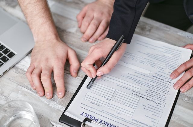 two people reading over a home insurance policy